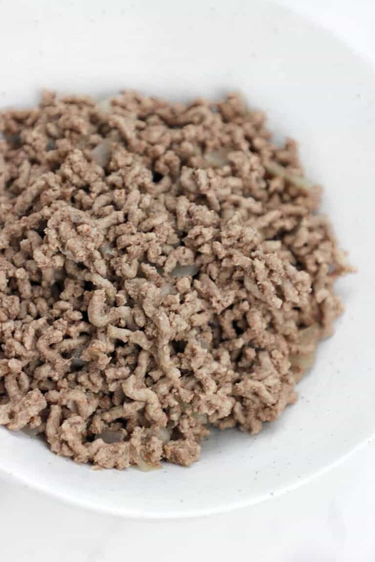 boiled ground beef served in a white plate.